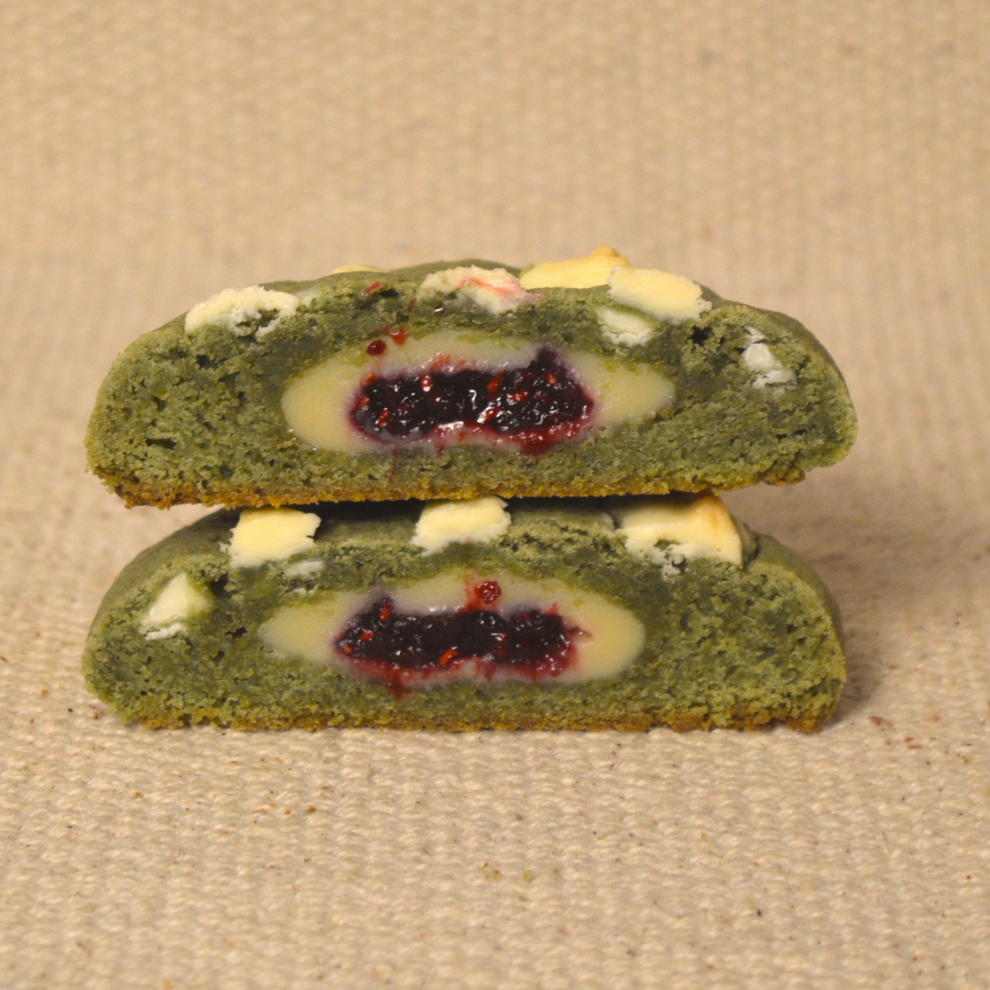matcha cookie filled with white brigadeiro and raspberry jam